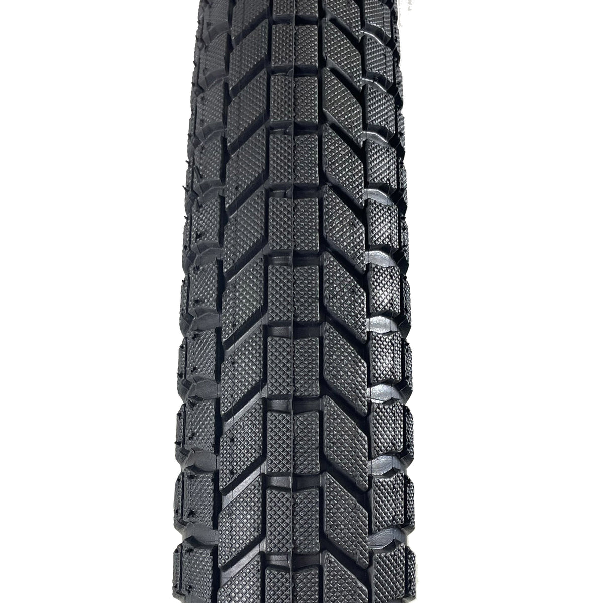 S&M Mainline 20-inch BMX tire featuring a black directional tread pattern with micro-knurled blocks for trail and street use.