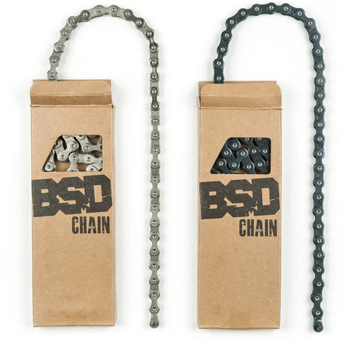 Silver and black BSD Forever BMX chains with half-link design, shown in branded cardboard packaging.