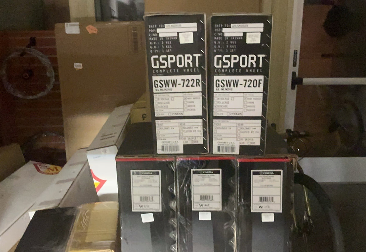 GSPORT Elite front and rear wheel set in black branded boxes with detailed product labels and cassette specifications.