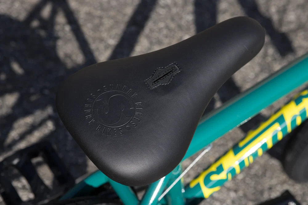 Black Sunday Badge pivotal seat on a gloss pine green Sunday Scout BMX bike frame.