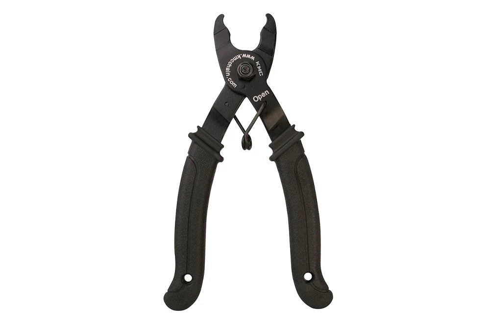 Black KMC Missing Link pliers with ergonomic rubberized handles and a spring-loaded design for opening bike chain links.