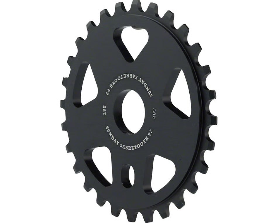 Black 6061-T6 alloy Sunday Sabretooth V2 BMX sprocket with a 28-tooth design and 6mm thick construction.
