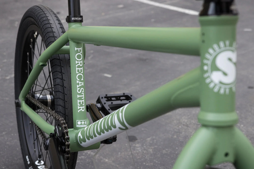 Matte sage green Sunday Forecaster Brett Silva signature BMX bike with 20.75-inch chromoly frame and white branding.