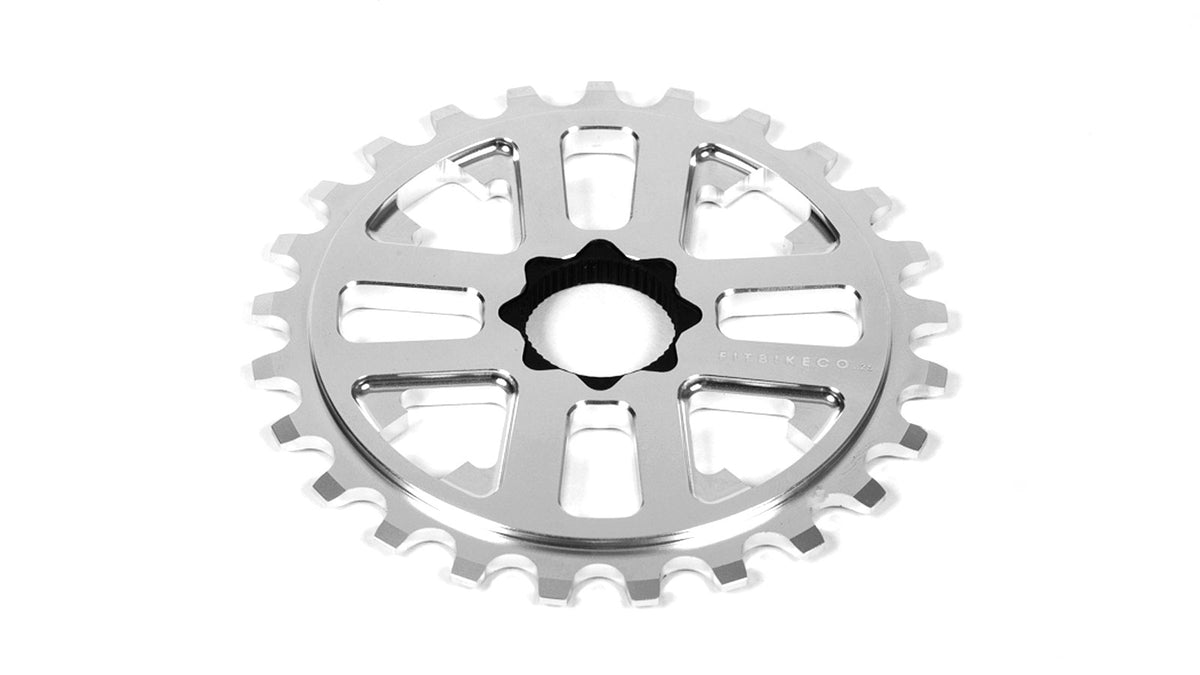 Silver CNC-machined aluminum Fit Key sprocket with 24mm 48-spline insert and arrow-style cutouts.