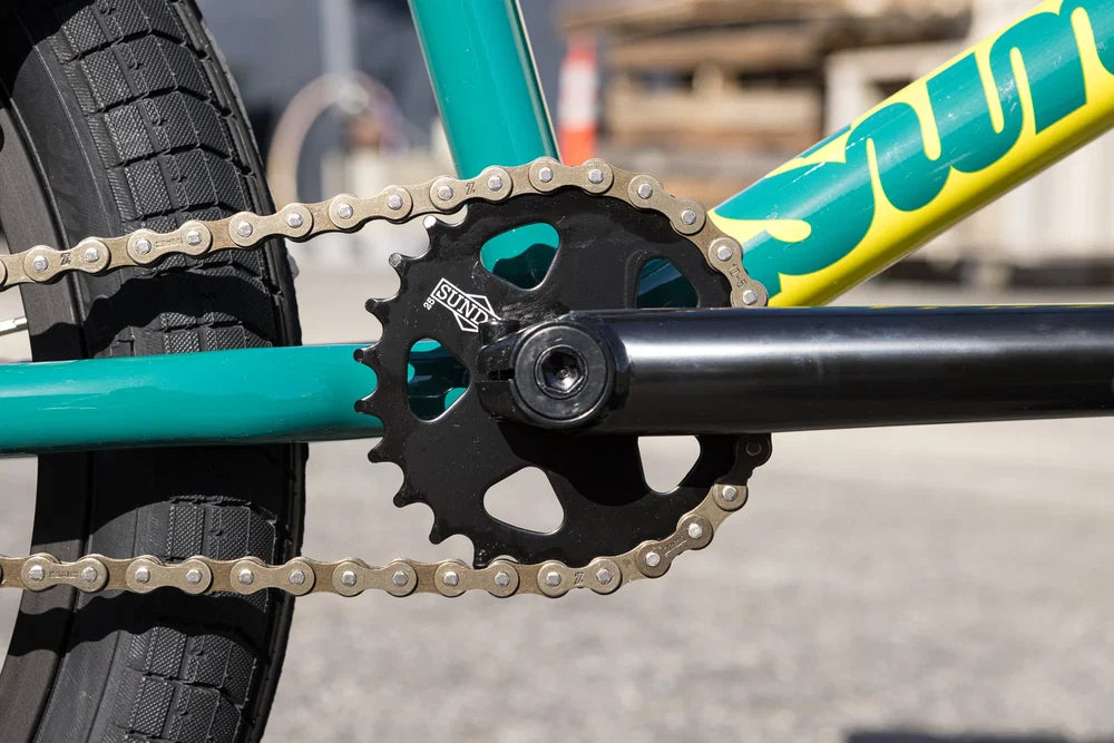 Gloss Pine Green Sunday Scout BMX bike frame with black sprocket, crank arm, and metal chain.