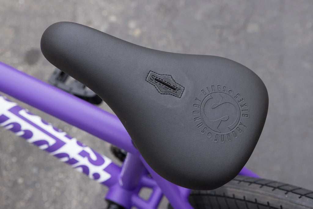 Matte Grape Soda Sunday Forecaster BMX bike featuring a black Sunday Badge pivotal seat and chromoly frame.