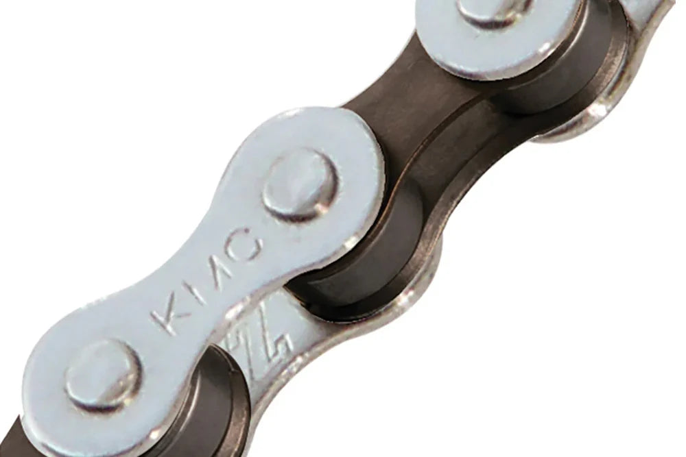 KMC S1 single-speed BMX chain featuring silver outer plates and brown inner links with embossed KMC branding.