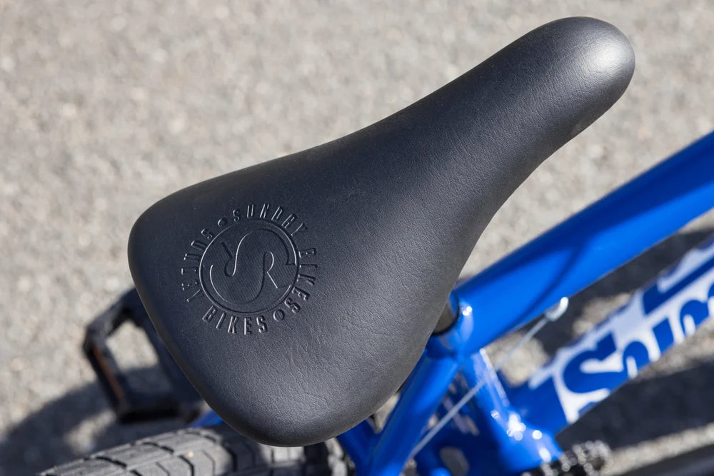 Black Sunday Bikes branded saddle on a gloss Sunday Blue BMX frame with white frame decals.
