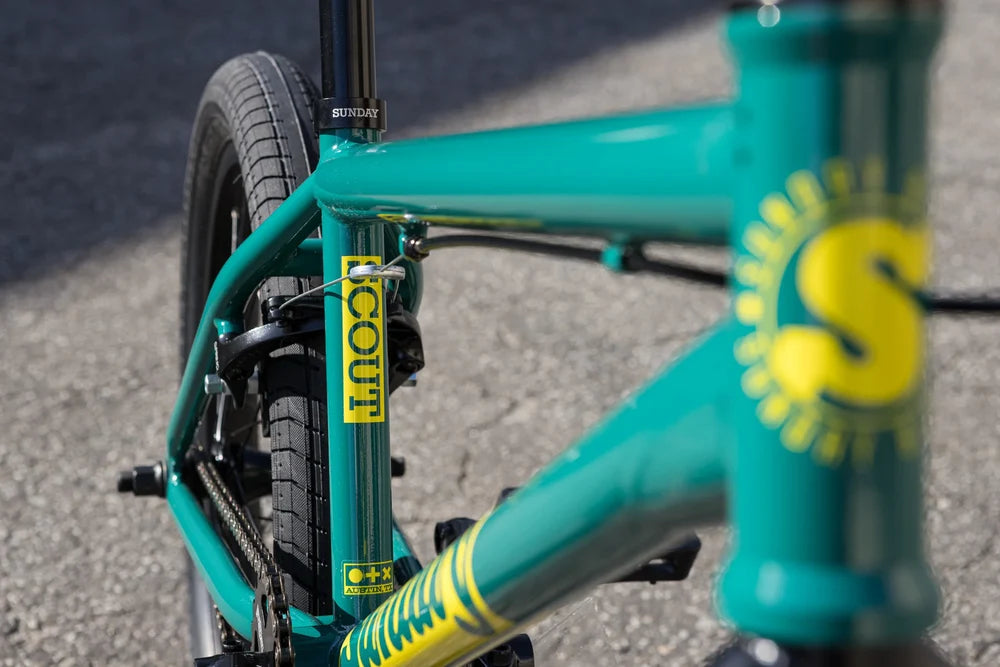 Gloss Pine Green Sunday Scout BMX bike frame with yellow branding and Odyssey brake components.