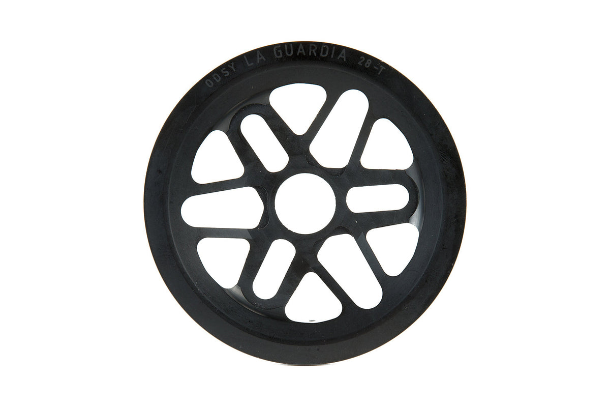 Odyssey La Guardia BMX sprocket in black with integrated full chain guard, front view