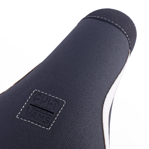 Black Cult x Vans pivotal BMX seat featuring a textured canvas top, white stitching, and a branded rubber patch.